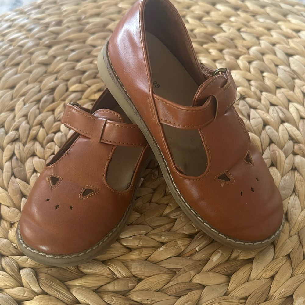 Mary Janes with Velcro latch. Comfy and still have lot of love left in them.